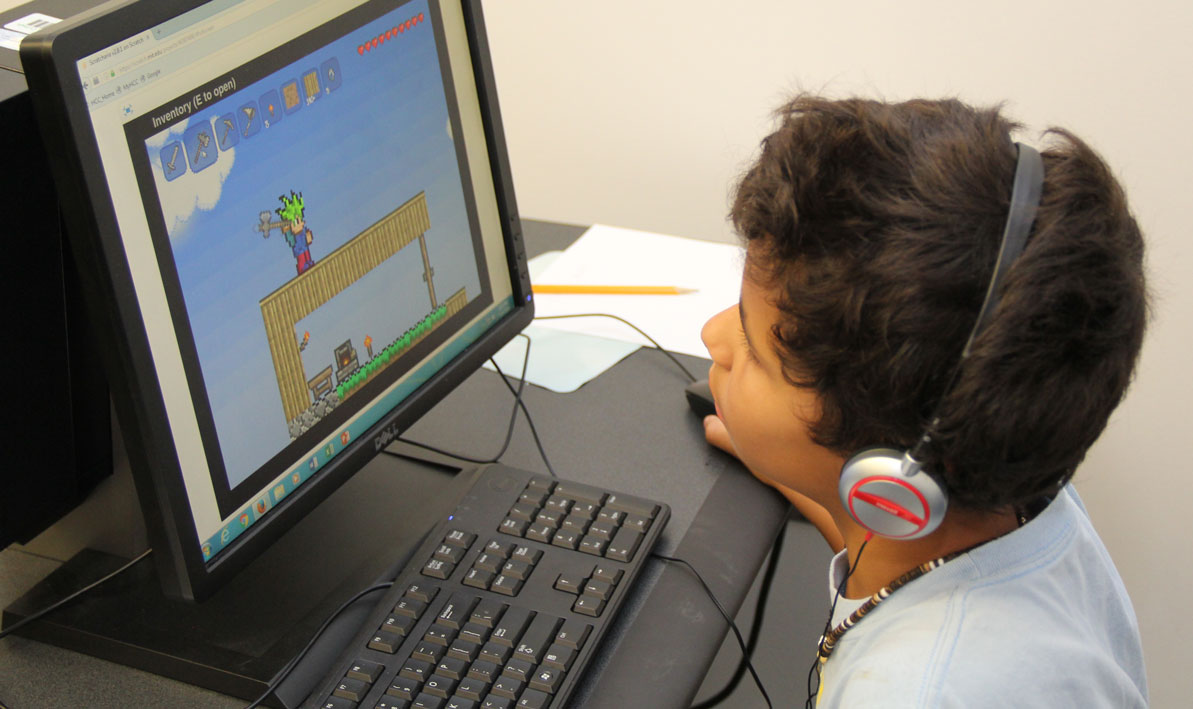 A boy builds a video game during a Summer Youth Program at HCC