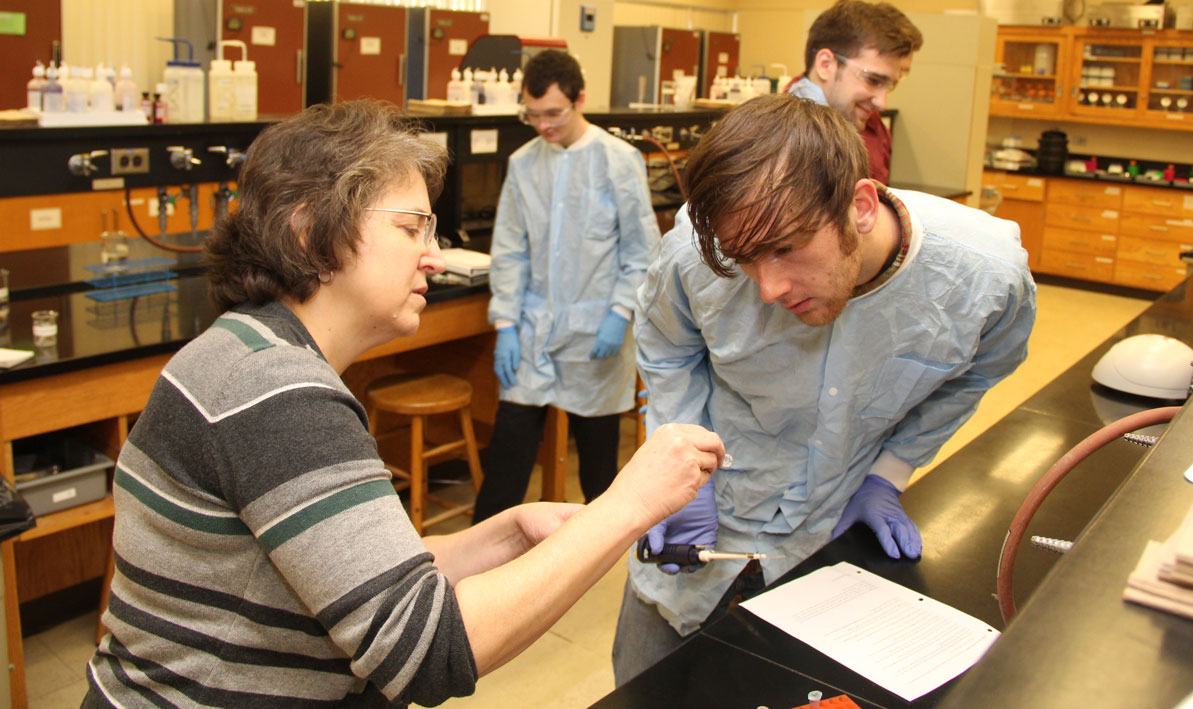 Honors biology professor Carolyn Wetzel with student Aaron Collette of Chicopee. 