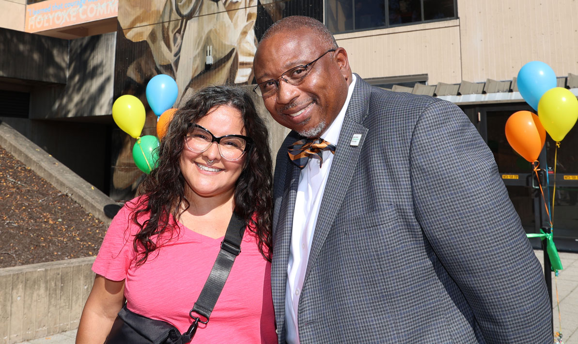 Muralist Betsy Casanas with HCC President George Timmons 