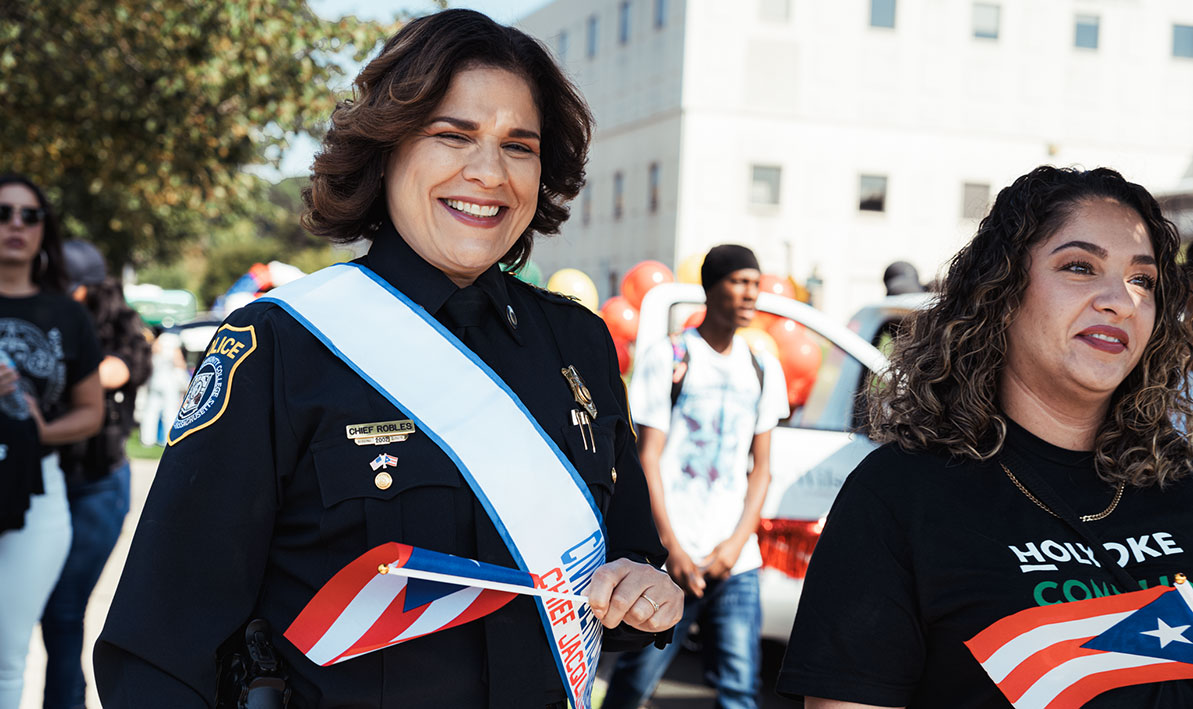 HCC Police Chief Jacqueline Robles marches in the Springfield Puerto Rican Day Parade as the 2025 civil service ambassador.
