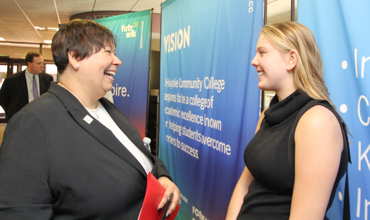 President Christina Royal talks to student Hayley Woods '19 in a photo from 2018. 