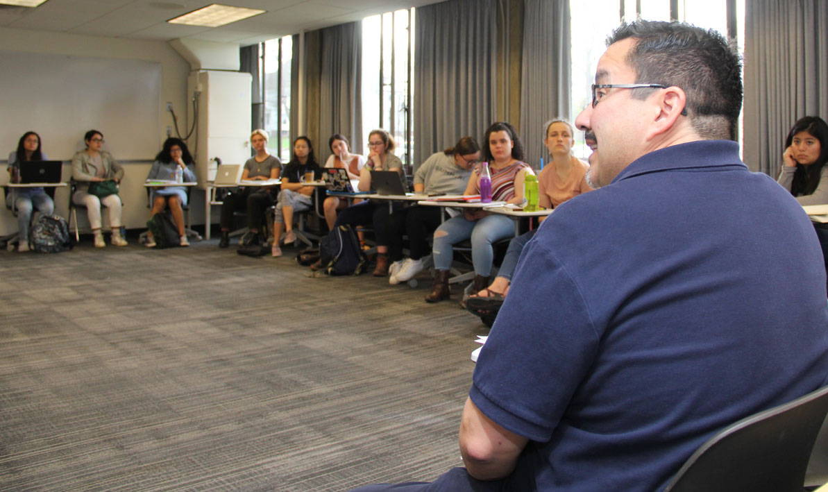 Mount Holyoke College professor David Hernandez makes a point during a joint HCC-MHC college course. 