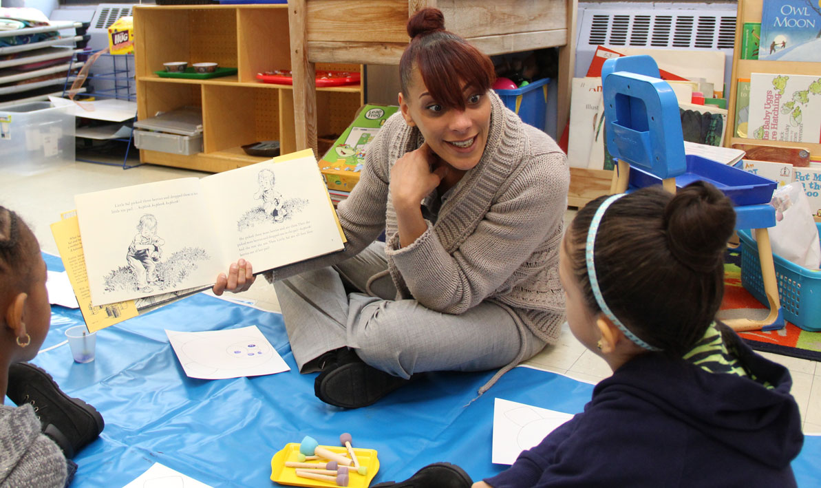 Cindy Soriano '19 of Northampton reads to pre-school students in Springfield