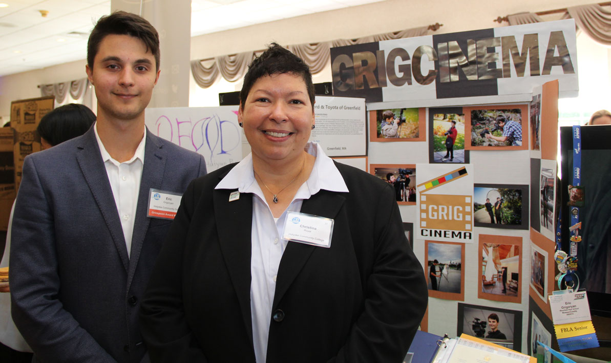 HCC student Eric Grigoryan with HCC president Christina Royal