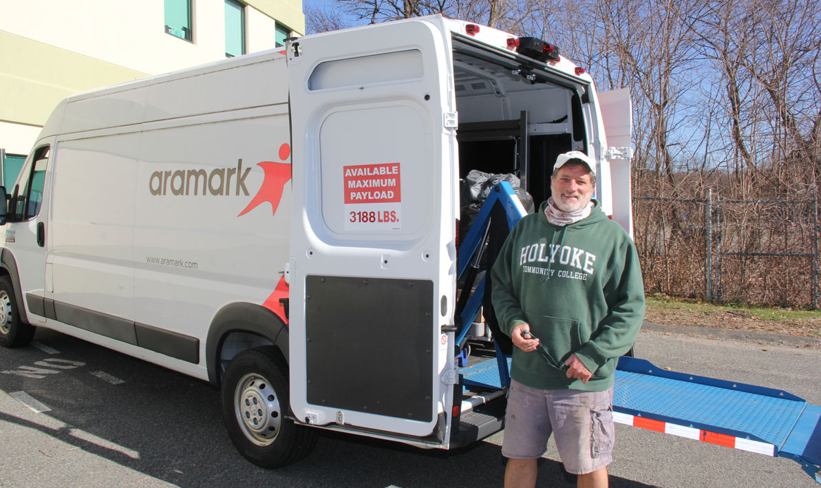 Mark Pronovost, HCC director of Ararmark/Dining Services load up a van with food to donate last month to the Easthampton Community Center. 
