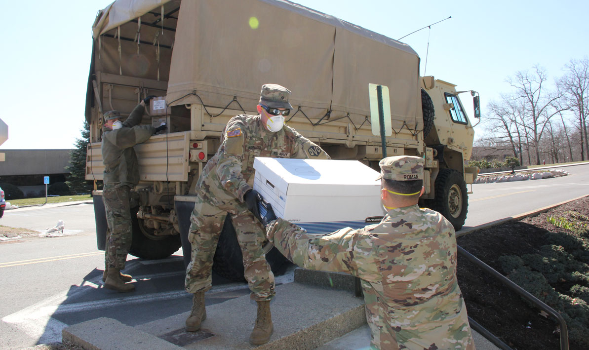 U.S. Army soldiers pick up medical supplies at HCC