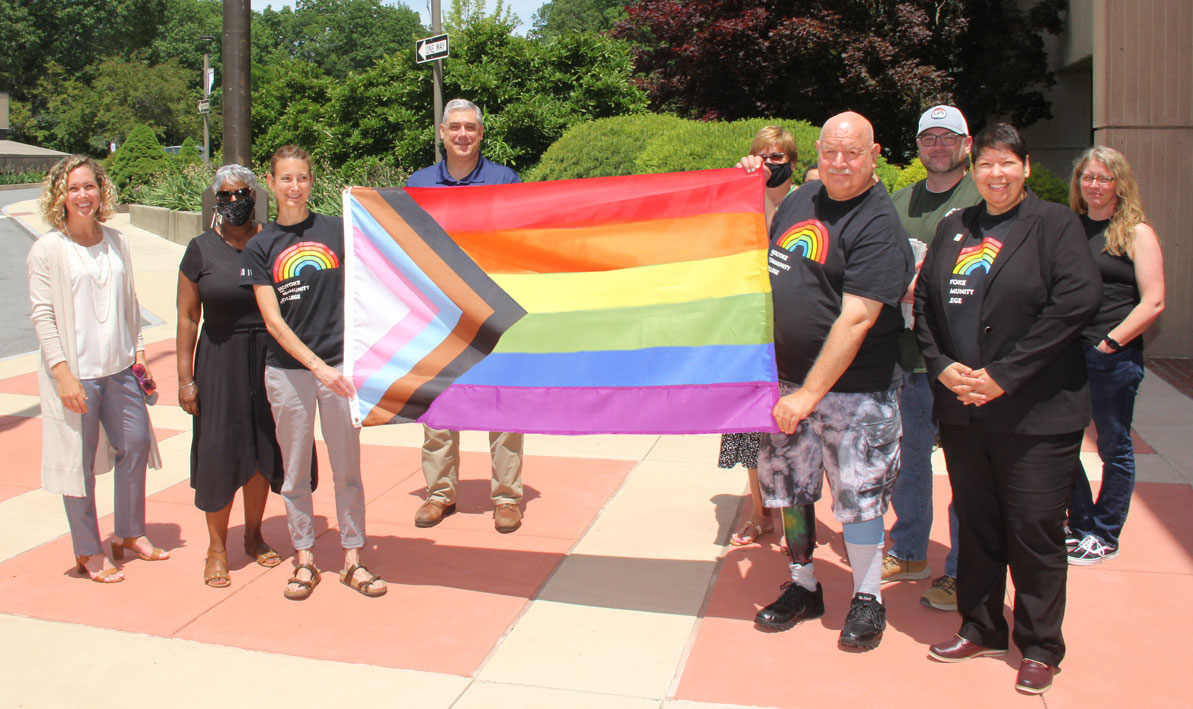 President Christina Royal and other members of the HCC community gather to celebrate Pride Month