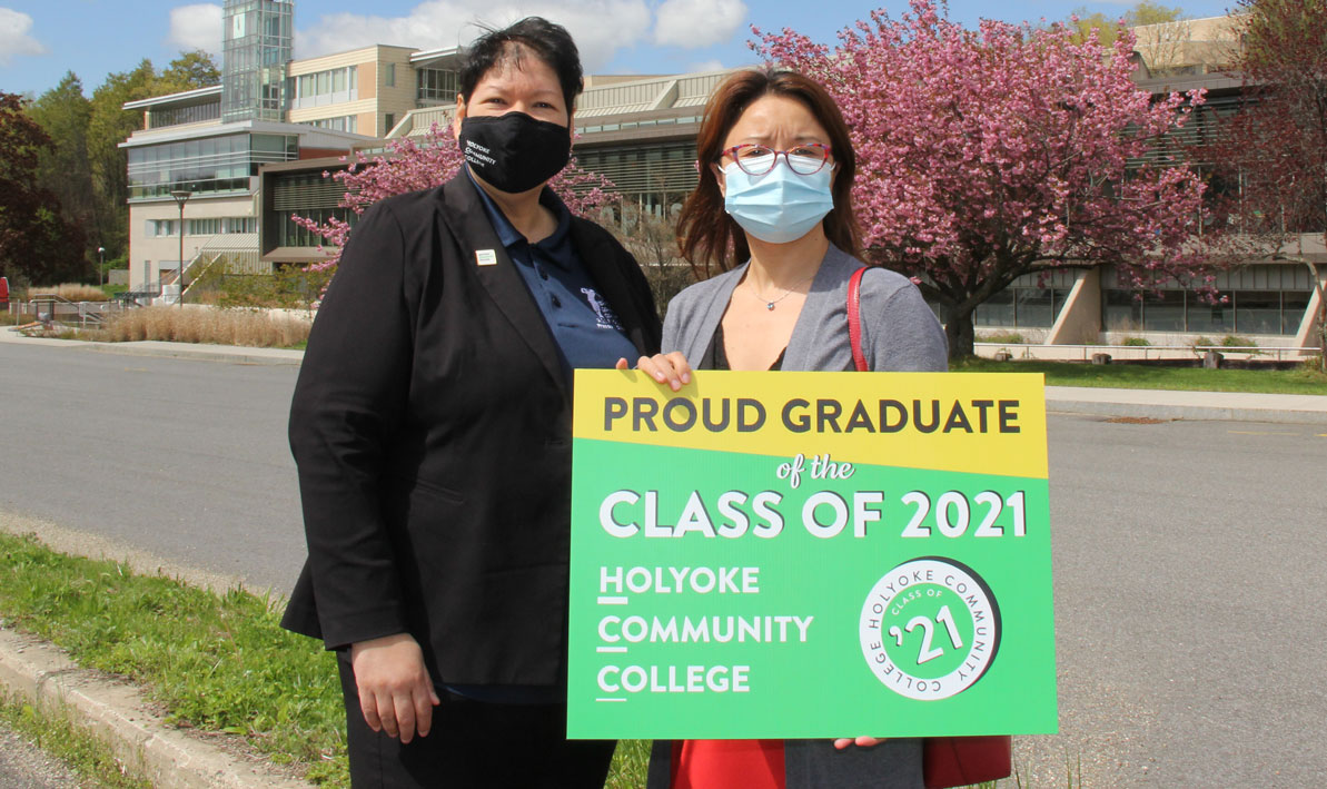 Xinhong Wu of Amherst celebrates her graduation with President Christina Royal at HCC in advance of Commencement 2021.