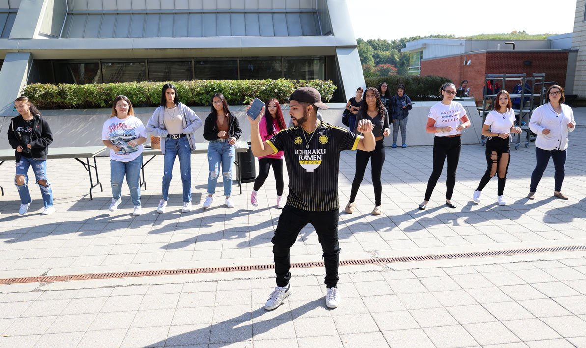 Dance instructor Kenneth Roche leads Bachata lessons in the HCC Courtyard during ESL Exploration Day. Wed., Oct. 12. 
