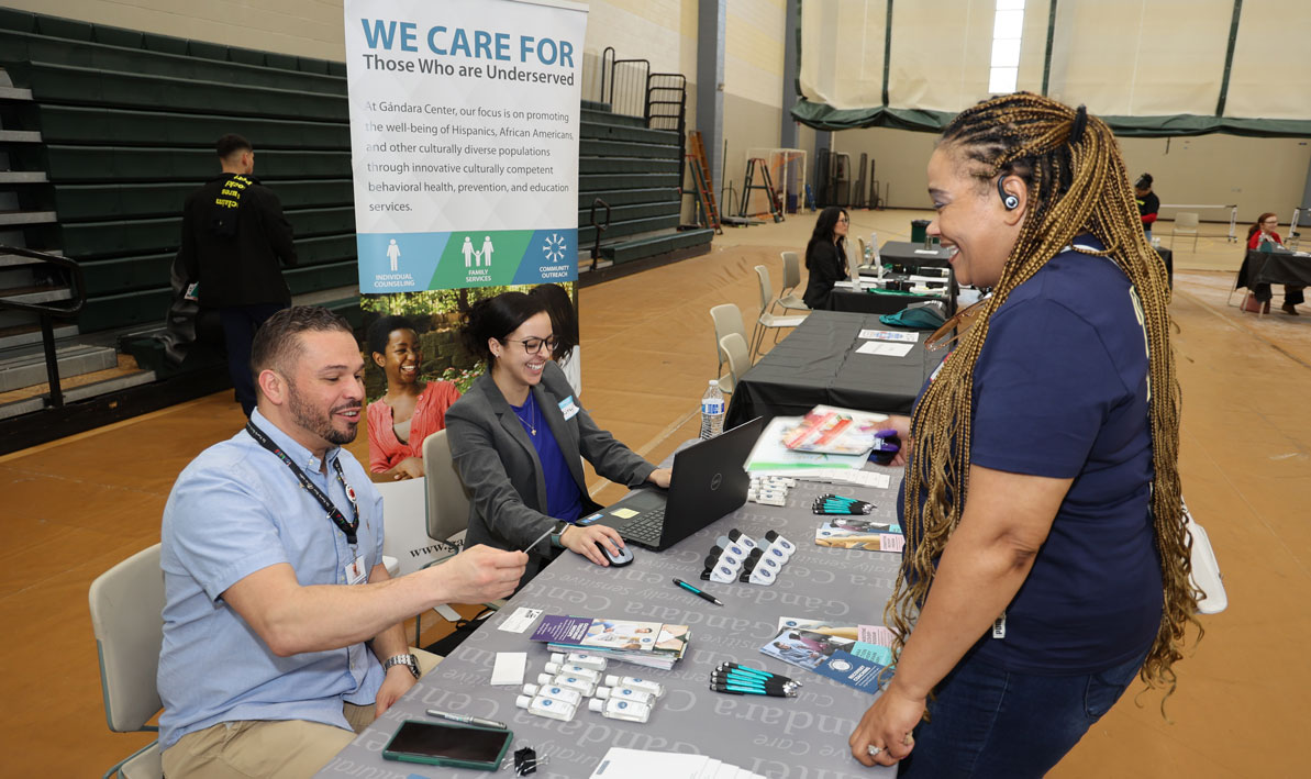 Staff from the Gandara Center talk to a potential employee at a recent job fair at HCC.