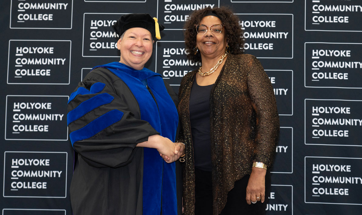 President Royal shakes hands with Darlene Mitchell