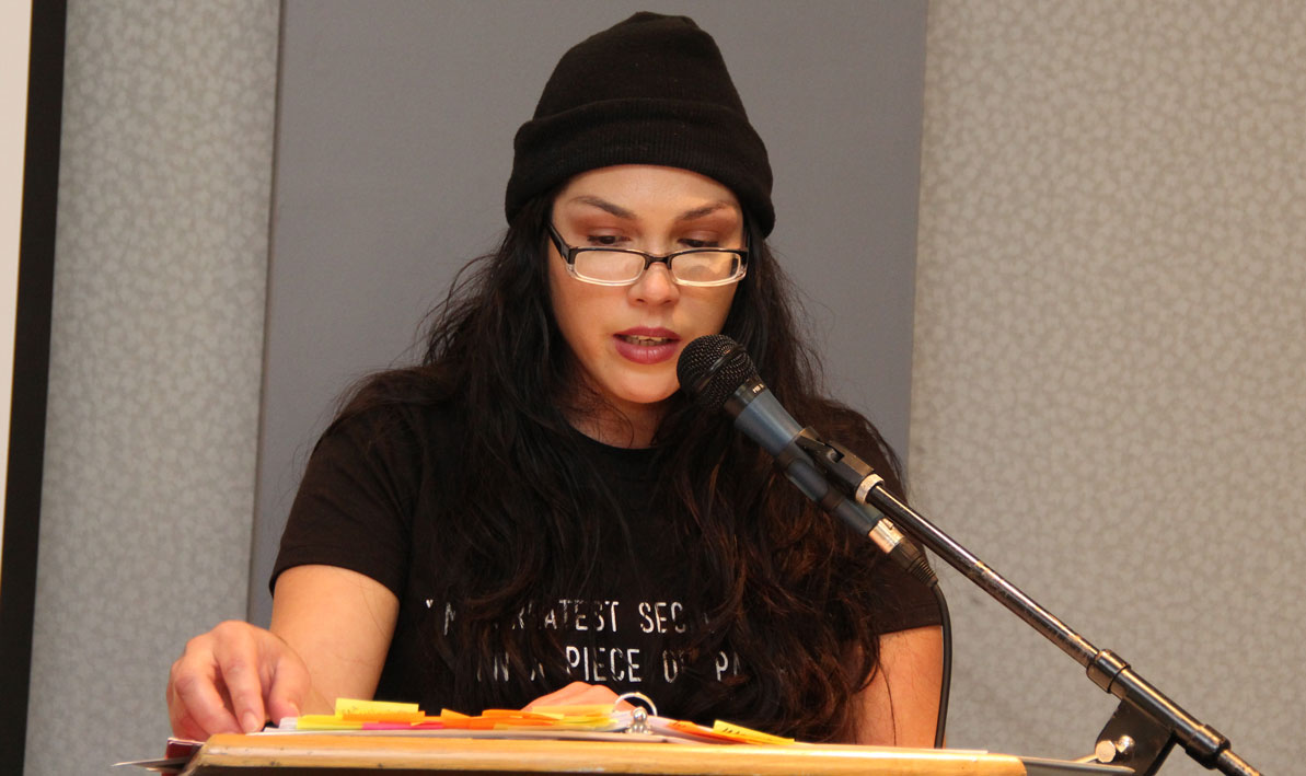 Sonia Mendez, who went on to graduate from HCC in 2020, reads her poetry during a Voices from Inside event at HCC in November 2015.
