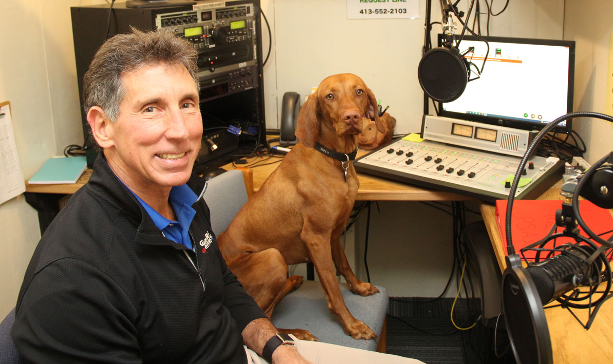 Auto dealer and HCC Foundation board member Gary Rome visits the studios of the college radio station, WCCH, with his dog Daisy. 
