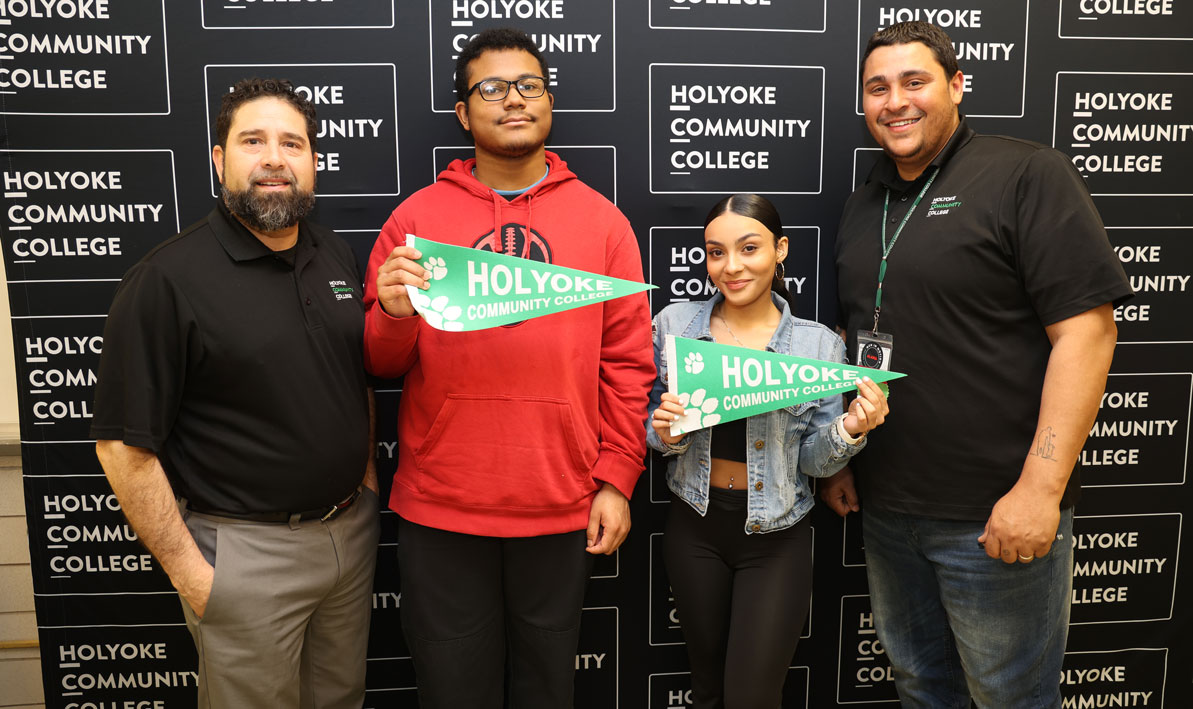 Left to right: HCC Admissions counselor Harold Santiago, Holyoke High School seniors Marquez Aponte and Jada Carrasquillo, and HCC ALANA mentor Miguel Velez, during an enrollment event at Holyoke High School. 