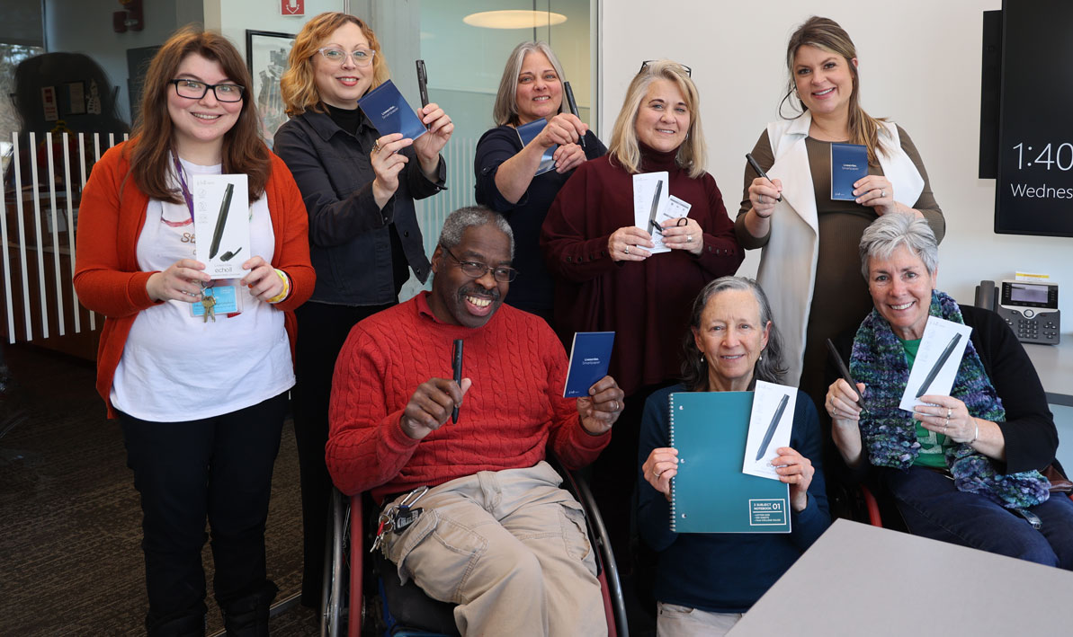 OSDDS staff show off the new smart pens that were purchased during an Institutional Advancement micro-philanthropy campaign last fall.