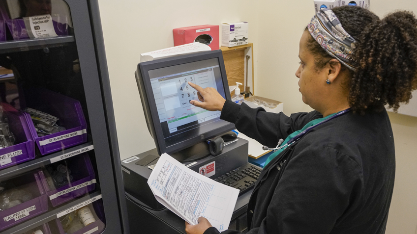 A medical biller uses a computer