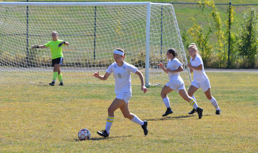 3 women's soccer defenders plus goalie