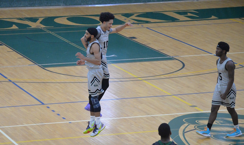 men' basketball celebrating 
