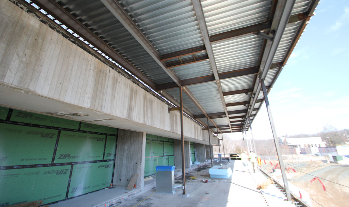 A new roof covers what used to be an external balcony and will eventually be enclosed to extend the dining room. 