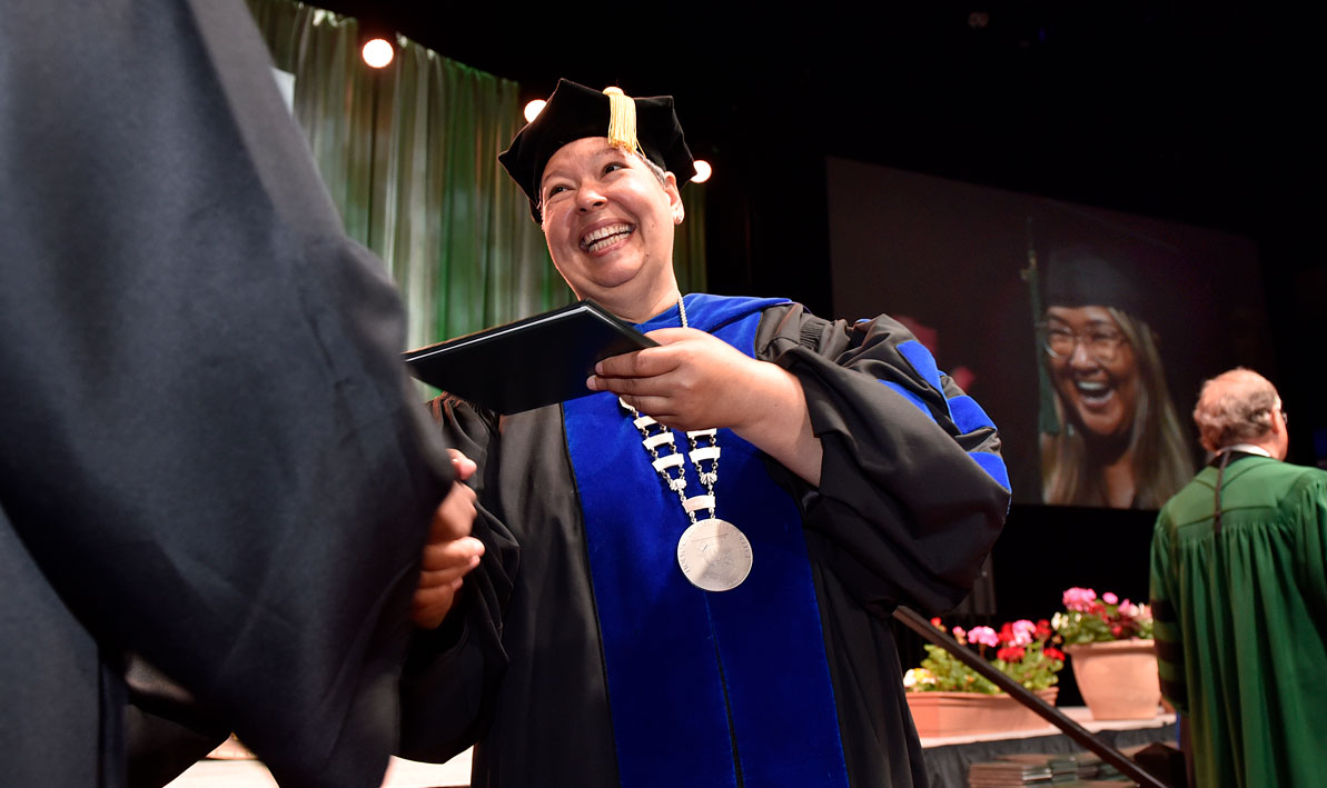 President Christina Royal hands out diplomas at Commencement on Sat., June 3.