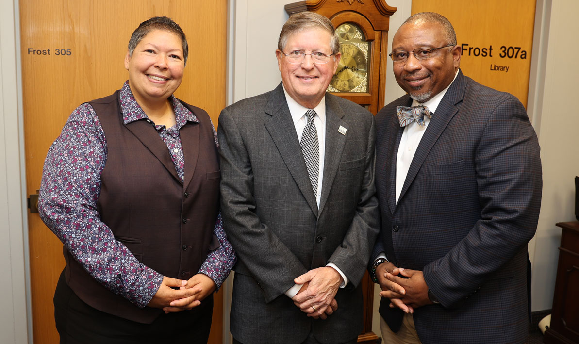 Retired President Christina Royal, left, and current President George Timmons bid farewell to Robert Gilbert after his last meeting as chair of the HCC Board of Trustees.