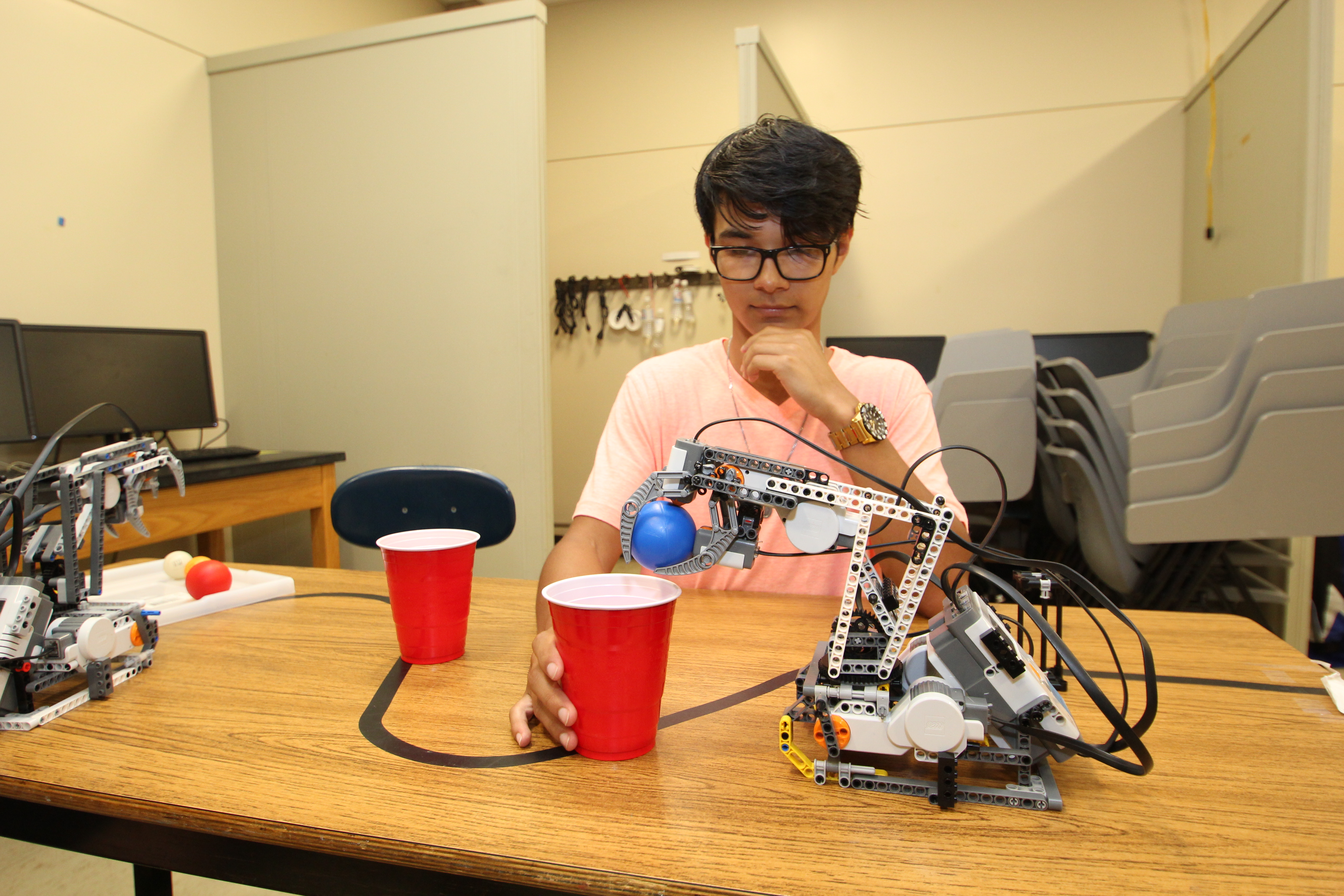 A student works on a robot