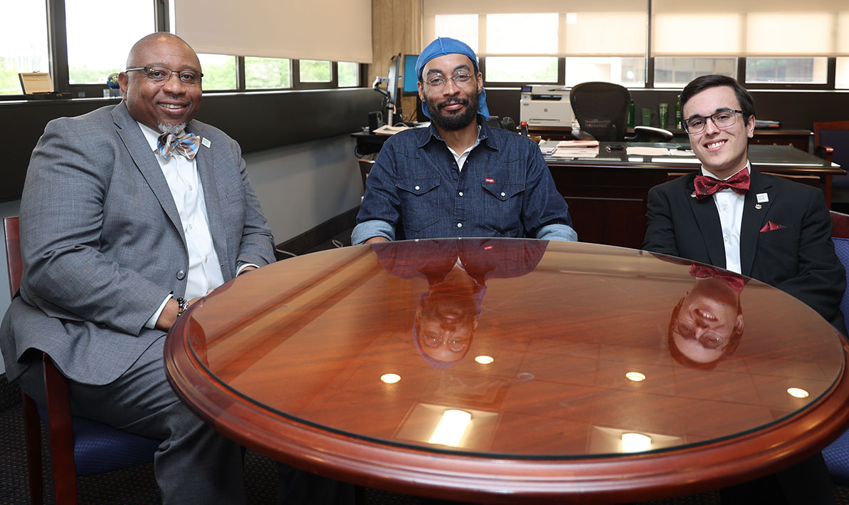 President George Timmons meets with new student-trustee E.J. Jackon and outgoing student-trustee Barney Garcia '24.