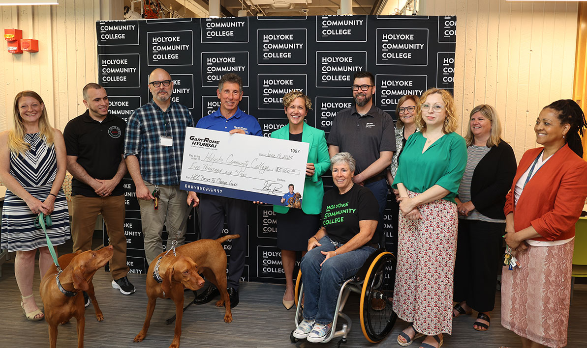 Auto dealer Gary Rome presents a $5,000 ceremonial donation check to Amanda Sbriscia, HCC vice president of Institutional Advancement and executive director of the HCC Foundation. 
