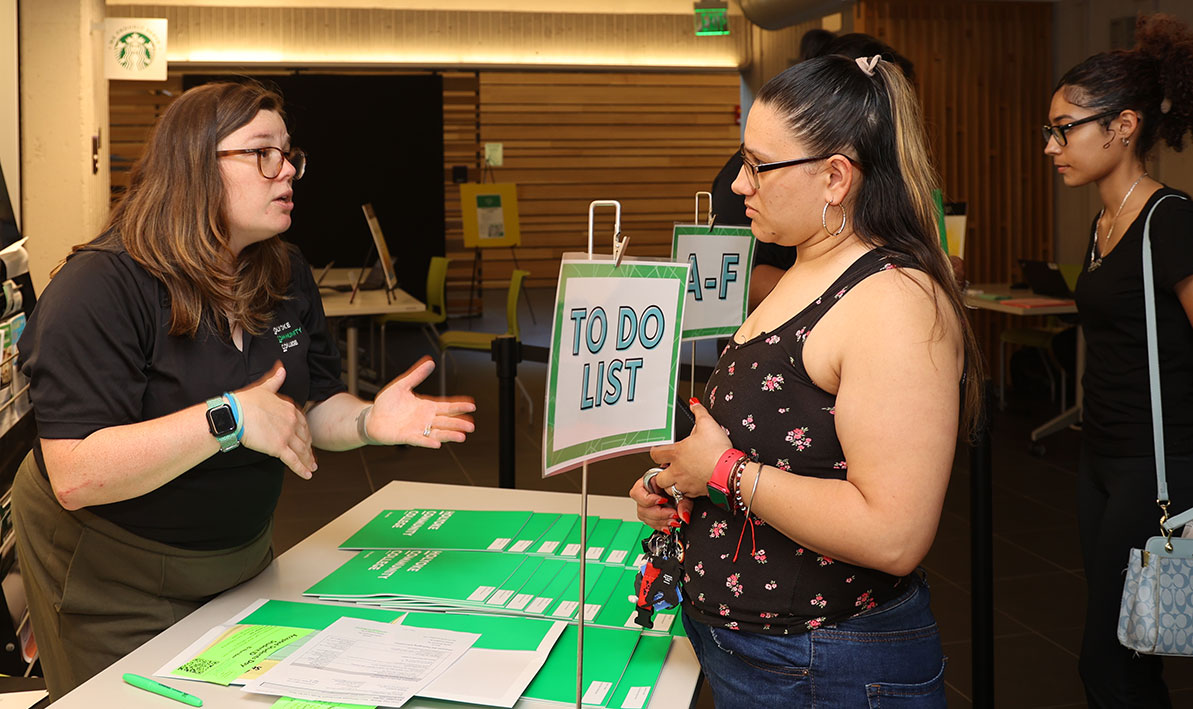 HCC Admissions staffer helps a new student