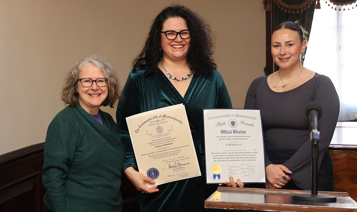 HCC Anthropology Professor Vanessa Martinez, center, holds proclamations from the state House and the Senate honoring her promoting civic engagement in her classes, with state Rep. Pat Duffy, left, and a representative from the office of state Sen. John Velis
