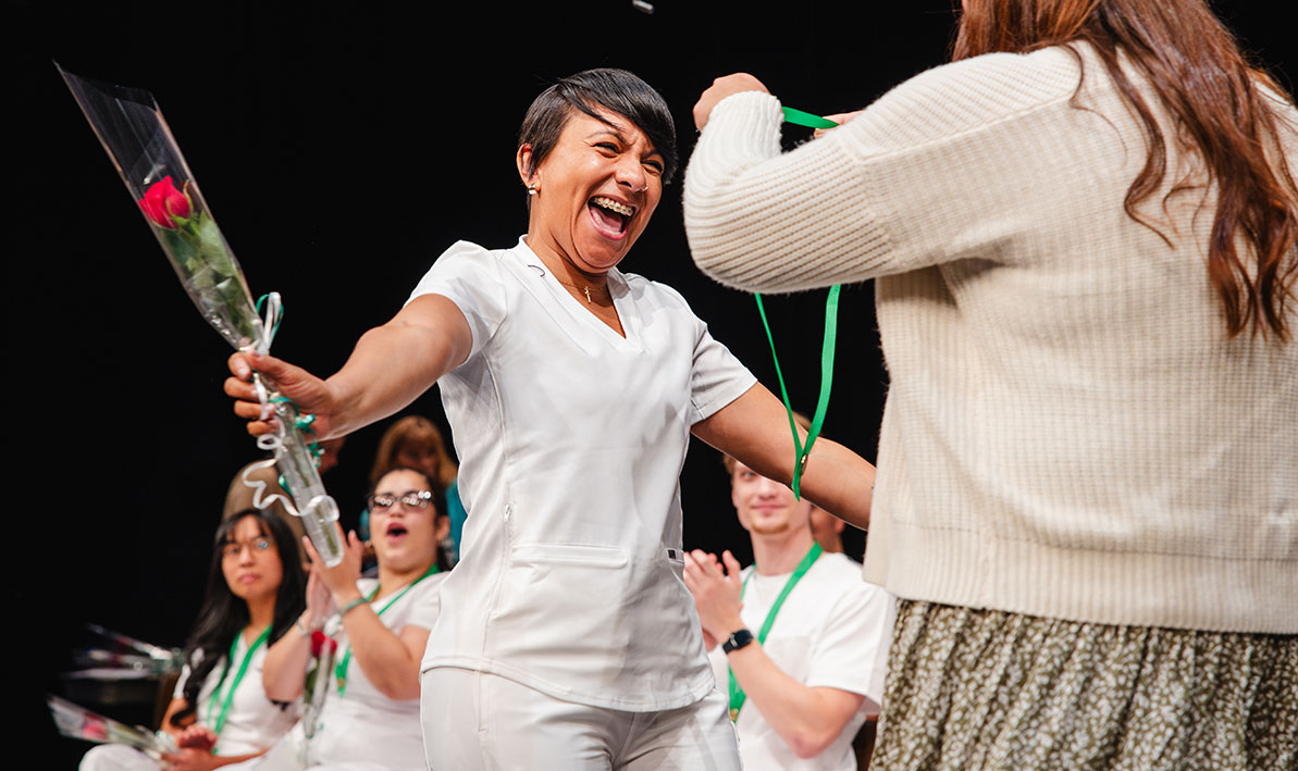 HCC nursing grad Luz Pizarro at 2026 pinning ceremony