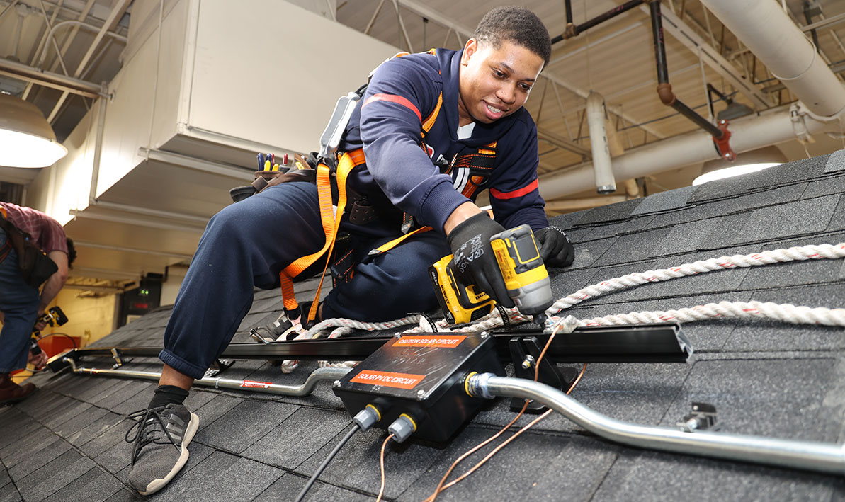 Jayshawn Brown of Springfield works on a solar panel installation training project