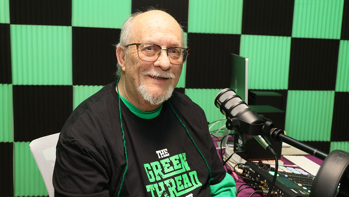 Alum Paul Rogers prepares for The Green Thread podcast. 