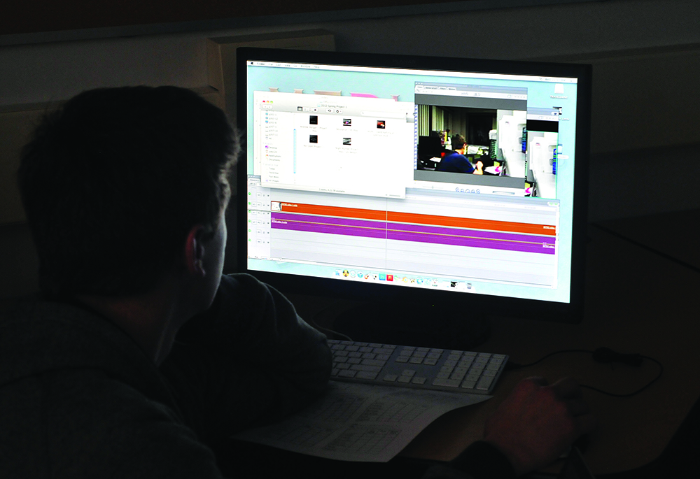 A student looks at a computer screen